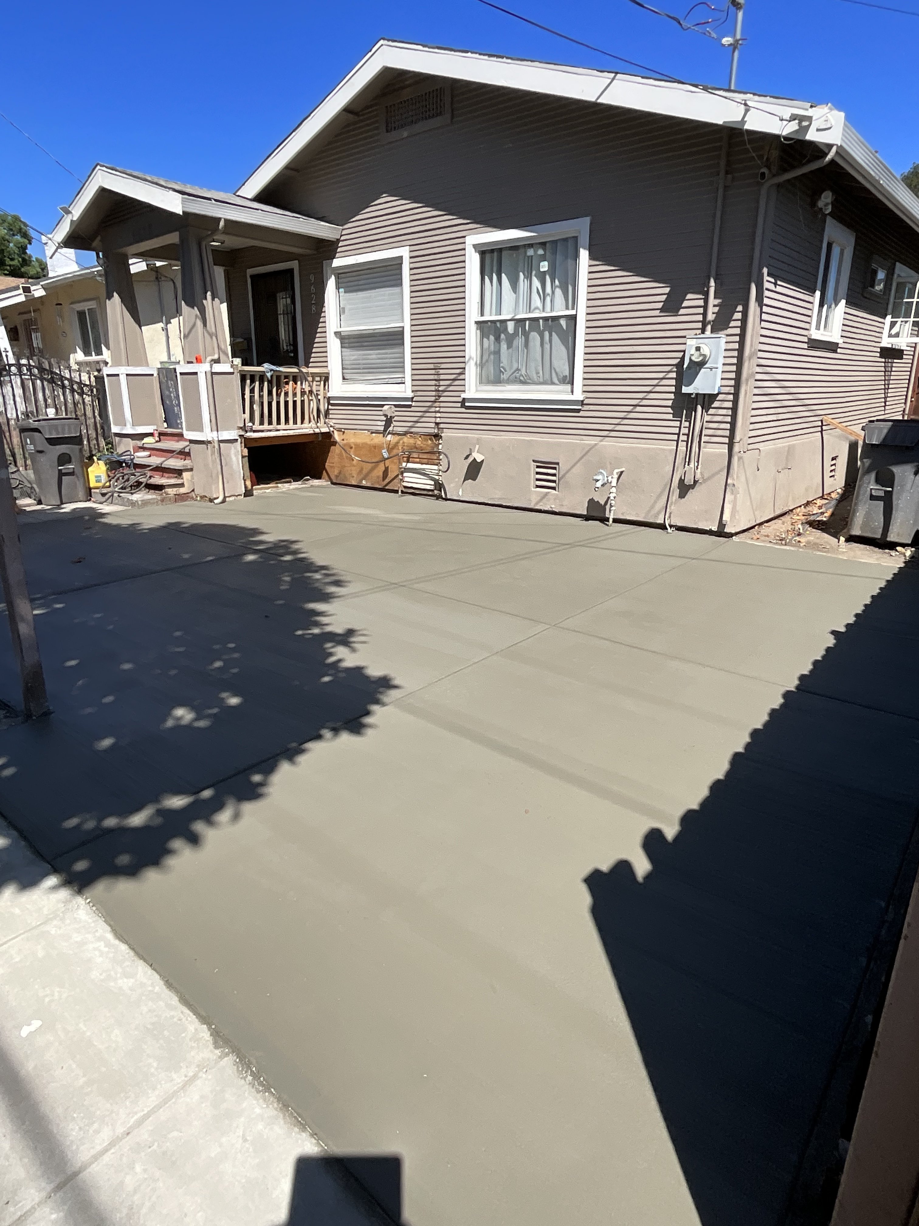 Fresh concrete driveway installation by BlackHawk Landscaping East Bay
