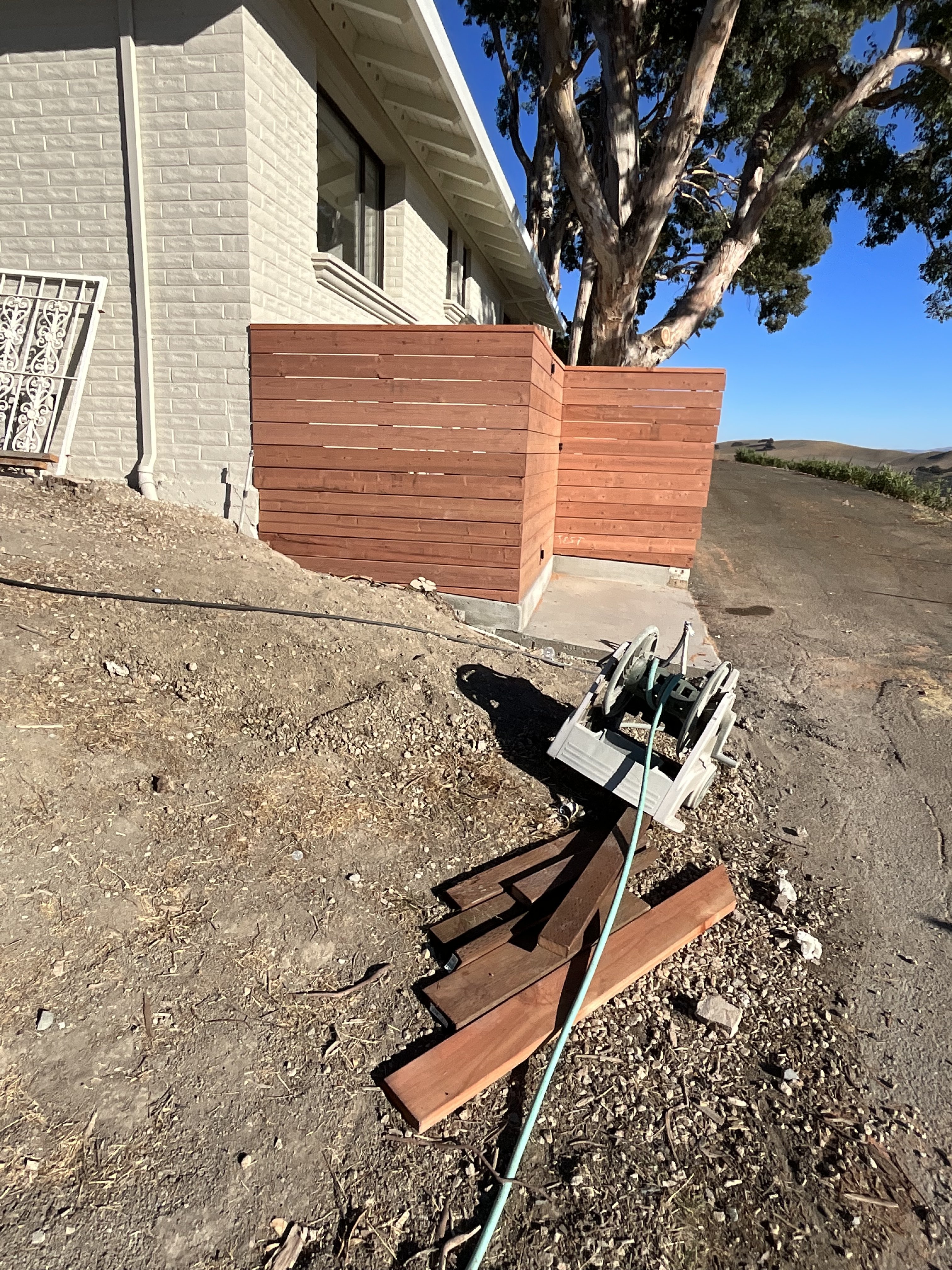 Wood privacy fence installation by BlackHawk Landscaping