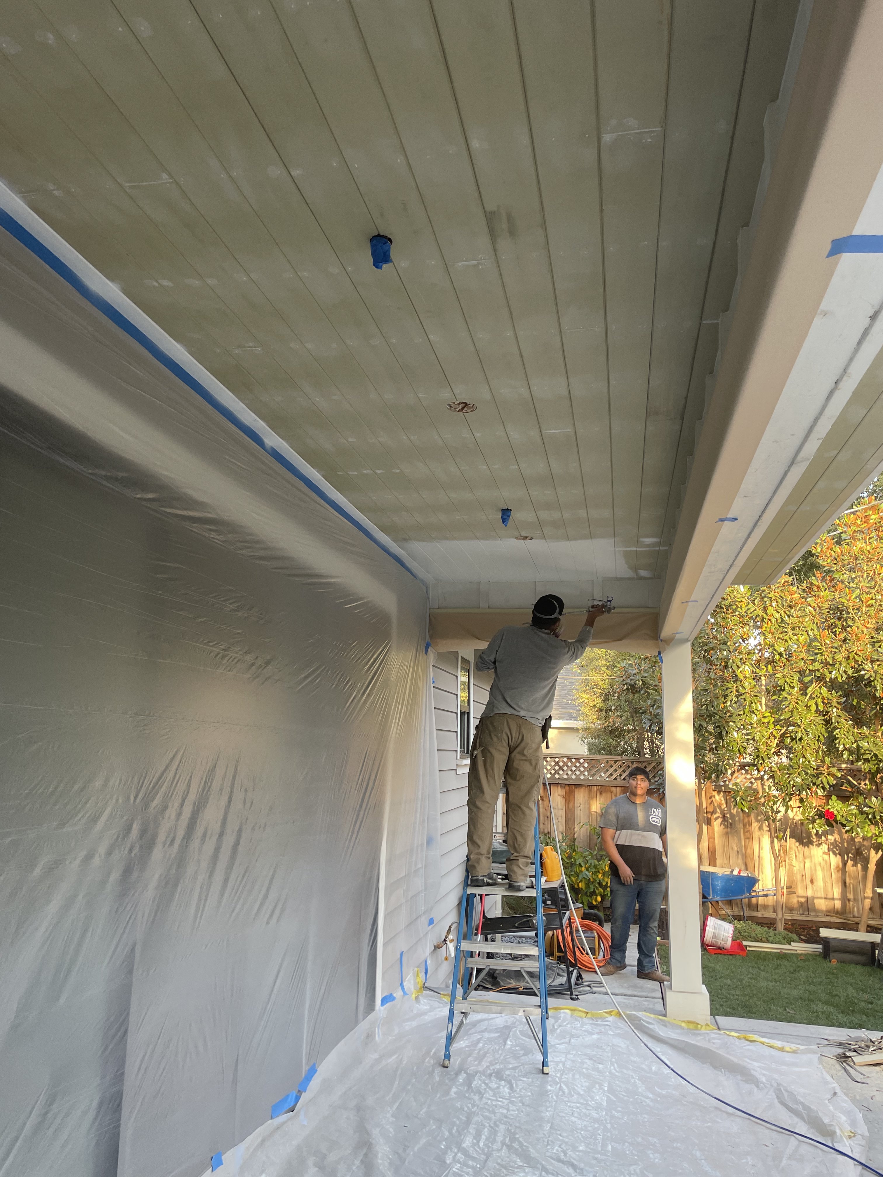 Patio cover ceiling work by BlackHawk Landscaping crew