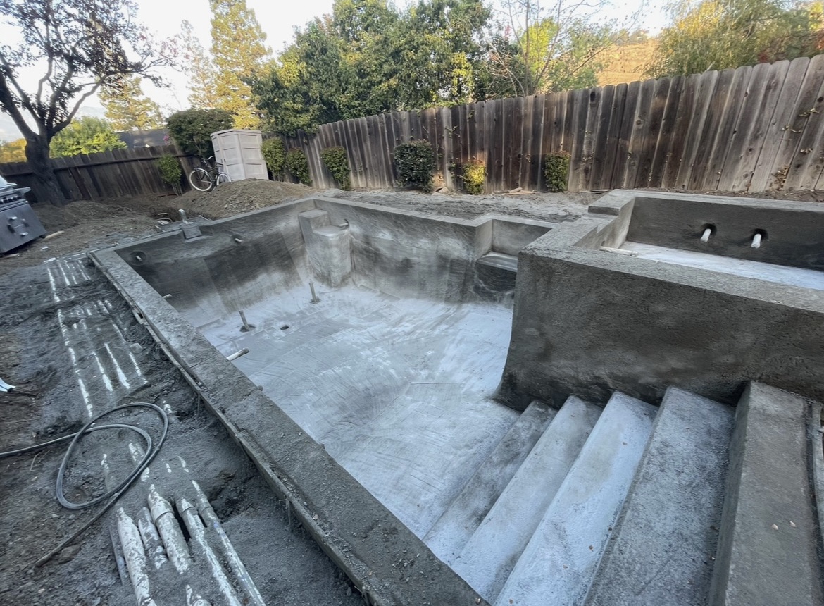 Pool shell construction in progress by BlackHawk Landscaping