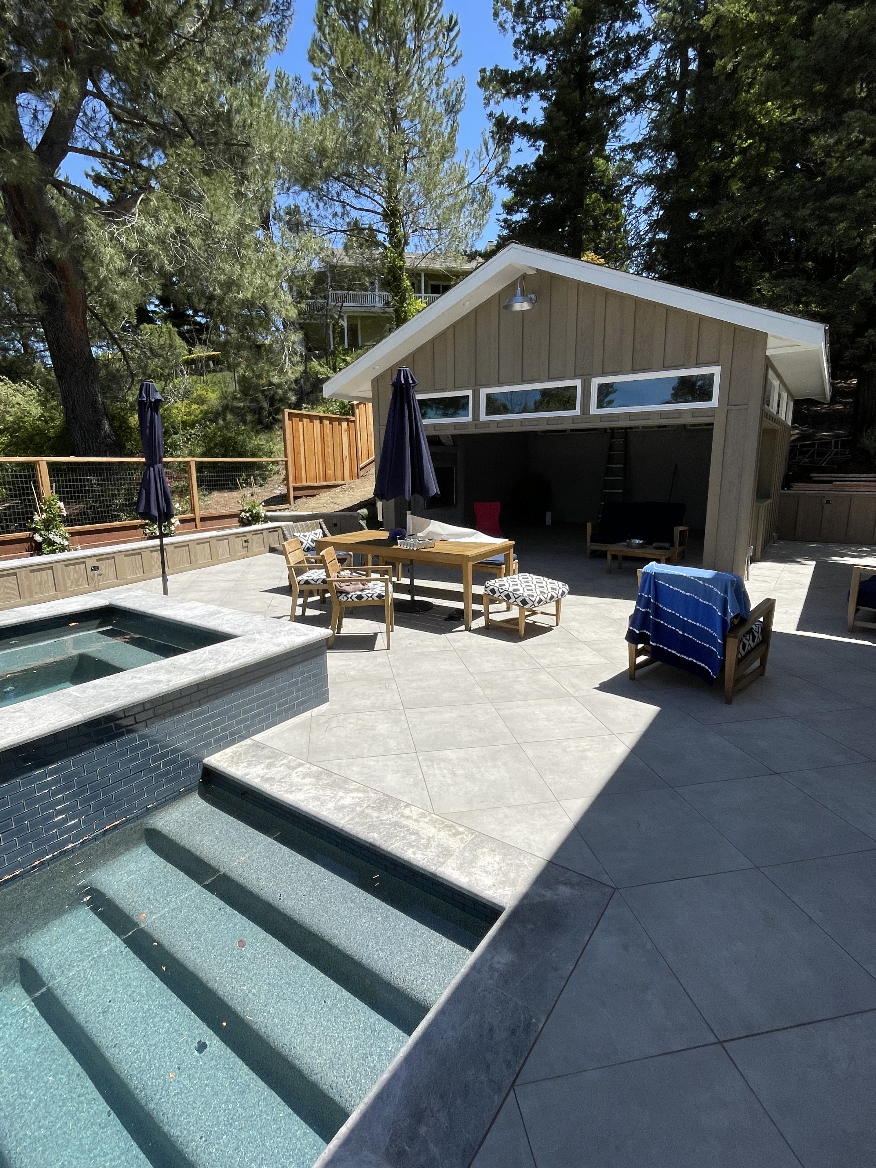Completed pool and spa with tile patio by BlackHawk Landscaping